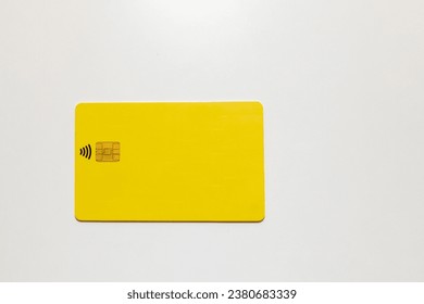 yellow bank card with a chip