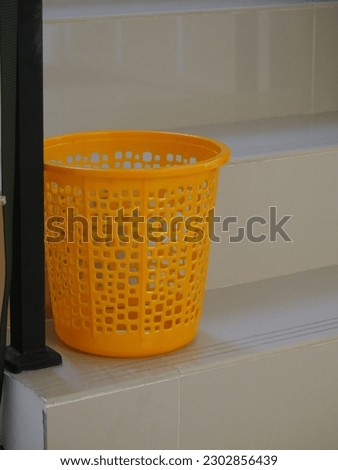 Yellow Basket At The Rail Stairs