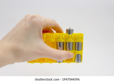 Yellow battery holder in the hand