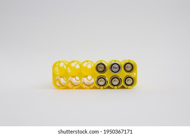 Yellow battery holder isolated on the light background