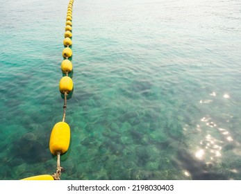 Yellow Beacon Buoy On Blue Sea Background,Over Light Day On Texture Surface Wave Ocean,Outdoor Nature,barricade For  Tourism Safety,Vacation Travel Tropical Summer In Holidays Concept.