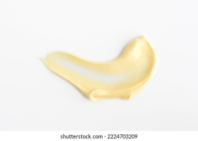 Yellow beauty mask (banana face cream, shea butter facial mask, body butter) swatch. Brush stroke with cream texture on a light background. - Shutterstock ID 2224703209