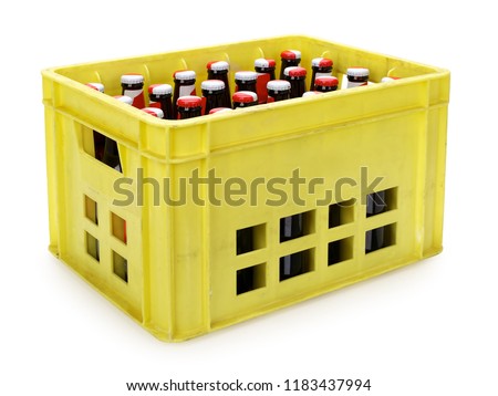 Yellow beer crate with bottles on white, contains clipping path