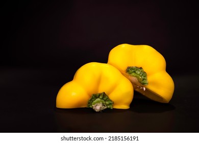 Yellow bellpepper or capsicum isolated on black background