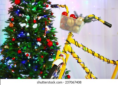 Yellow bicycle near Christmas tree