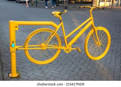 Yellow Bike On The Street In Reykjavik. Iceland. Travel And Tourism