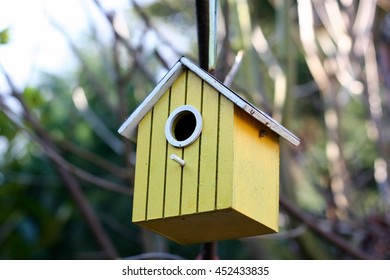 Yellow Bird House In The Garden