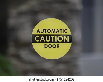 Yellow And Black Automatic Caution Door Sign