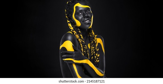 Yellow And Black Body Paint. Woman With Face Art. Young Girl With Bodypaint. An Amazing Model With Makeup.