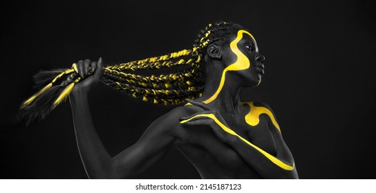 Yellow And Black Body Paint. Woman With Face Art. Young Girl With Bodypaint. An Amazing Model With Makeup.