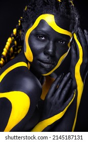 Yellow And Black Body Paint. Woman With Face Art. Young Girl With Bodypaint. An Amazing Model With Makeup.