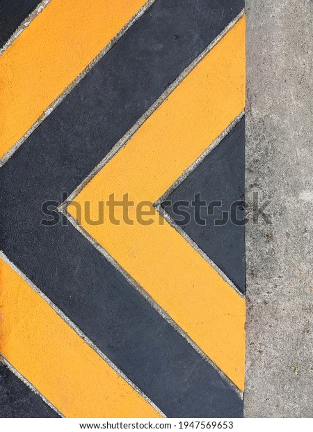 Yellow and black lines (looking like arrows) or\
yellow lines on the curb or footpath are \