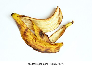 Yellow And Black Ripe Banana Skin. Banana Peel On A White Background. View From Above.