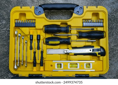 Yellow black toolbox, tools kit case detail close up on the ground. instruments. set of hand tools. car tool kit. tool set background. instruments for repair - Powered by Shutterstock