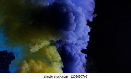 Yellow And Blue Bomb Smoke On Black Background