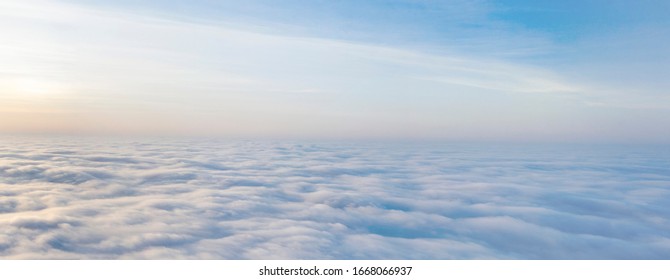 Yellow and blue dawn over clouds, concept, travel and leisure. - Shutterstock ID 1668066937