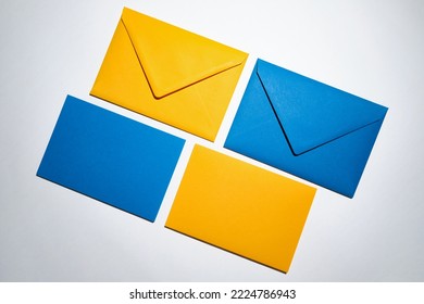 Yellow and blue envelopes on a white background. A set of envelopes in different types. Paper envelopes for inscriptions. Top view mockup - Shutterstock ID 2224786943