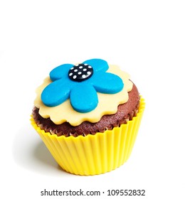 Yellow Blue Flower Decorated Cupcake Isolated