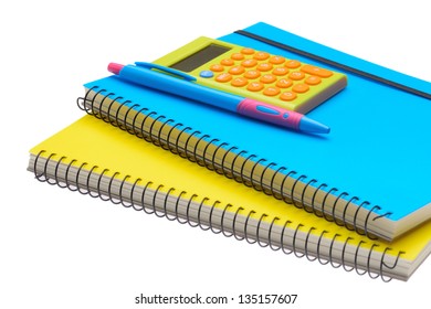 Yellow And Blue Note Book Calculator And Pen Isolated On White Background