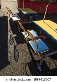 A Yellow And Blue Picnic Bench