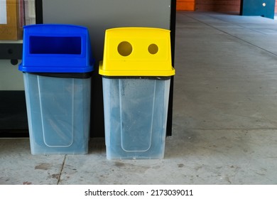 Yellow And Blue Recycle Bin For Separating Various Types Of Garbage In Office.