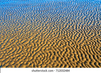 Yellow Blue Sand And Sea Water Background. Alluvium Image.   