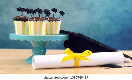 Yellow And Blue Theme Graduation Party Cupcakes With Cap Hats Toppers And Decorations.