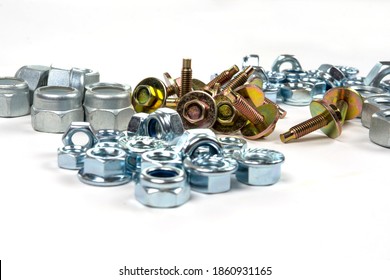 yellow bolts with washers and shiny nuts on a white background - Shutterstock ID 1860931165
