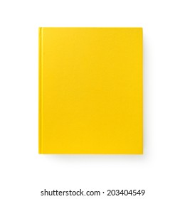 Yellow book. Closed book is laying on white. #1