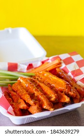 Yellow Bottom Chicken Strips On Buffalo Takeout Plate