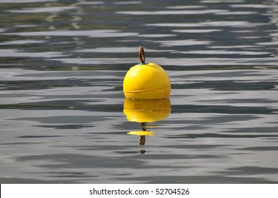 Yellow Bouy Floats In The Holy Loch, Near Dunoon