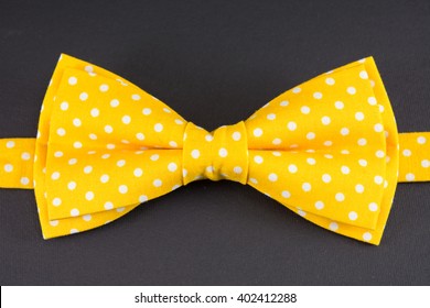 Yellow Bow Tie On Black Table