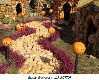 Yellow Brick Road In The Oz Country Made From Pumpkins And Flowers. Autumn Harvest Decorations, Background For Halloween, Thanksgiving Day