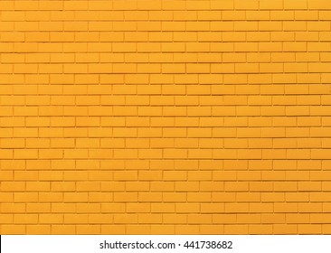 Yellow brick wall background.
