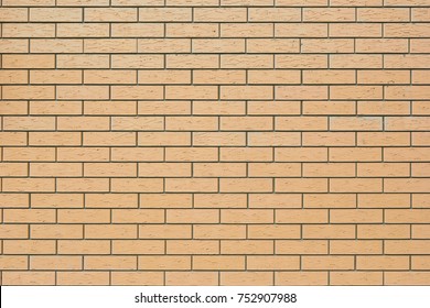 Yellow brick wall vintage background. Wallpaper surface cleaned structure of brickwork.