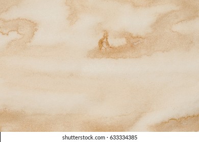 Yellow brown stained tea paper background.