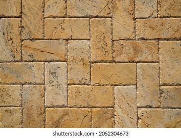 Yellow Brown Stone Pavers Background. Neutral Texture Of A Flat Brick Wall Close-up.        