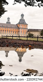 Yellow Building With Rainwater Pond