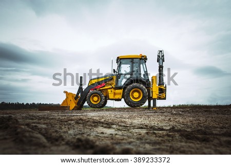 Yellow bulldozer overcome barrier