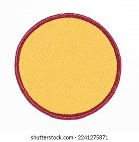 Yellow with burgundy trim circle patch isolated.