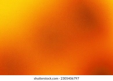 Yellow burnt orange red fiery golden brown black abstract background for design. Color gradient. Rough, grain, noise. Colorful bright spots.