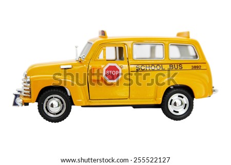 Yellow bus toy isolated on white background