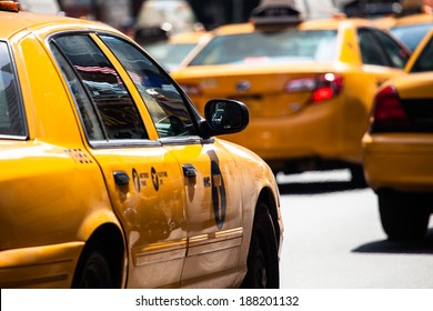 Yellow cab speeds through Times Square in New York, NY, USA.  - Powered by Shutterstock