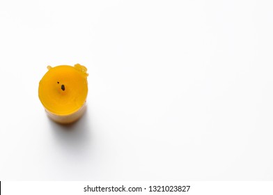 Yellow candle isolated on a white background - Shutterstock ID 1321023827