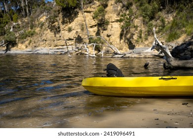 yellow canoe and kayak on a sandy beach in Australia in summer. kayaking on the sea - Powered by Shutterstock