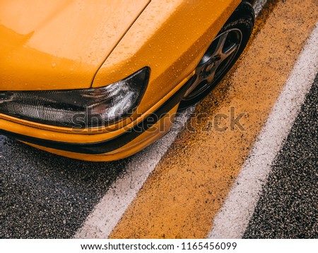 Yellow car on the road background