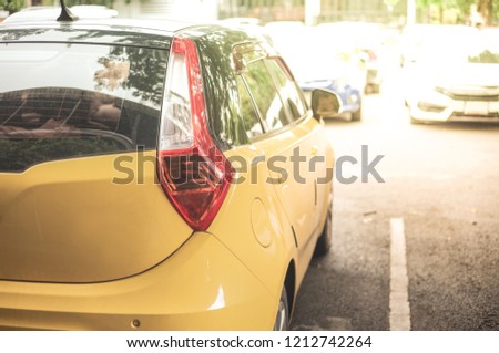 Yellow car in the car park,Background of cars in car parking lot