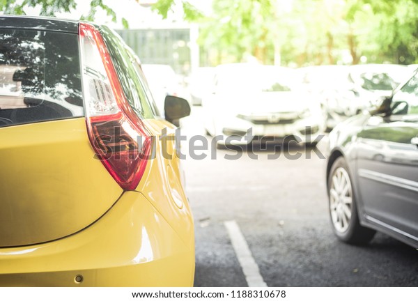 Yellow car in the car park,Background of cars in car\
parking lot