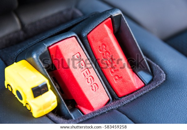 Yellow car symbolizing car safety belt cross-up\
and safety