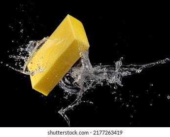 Yellow Car Washing Sponge Water Splash On Black Background